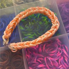 several different colored bracelets in plastic containers