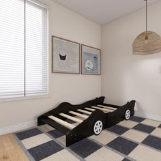 a black and white checkered floor in a bedroom with a bed frame on the ground