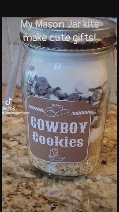 a jar filled with cookies sitting on top of a counter