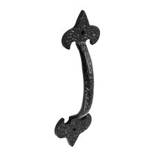 an ornate iron door handle on a white background