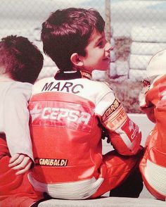 two young boys sitting next to each other