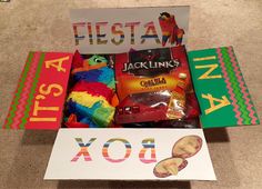 a gift box filled with candy, cookies and other items for kids to make their own