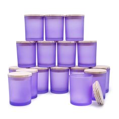 a bunch of purple plastic cups with lids