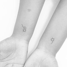 two small tattoos on both wrist