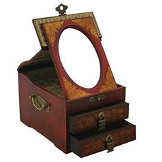 an ornate wooden jewelry box with mirror on top