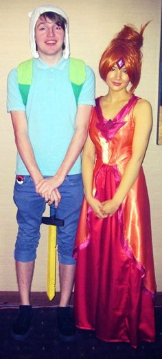 two people in costumes standing next to each other