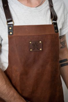 a man wearing an apron with leather straps