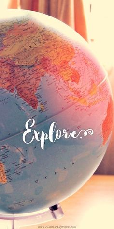 a globe with the word explore written on it