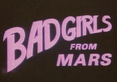 the bad girls from mars logo is shown in pink and purple letters on a black background