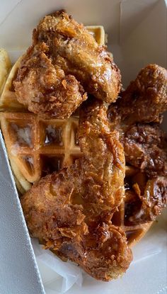 fried chicken and waffles in a white container