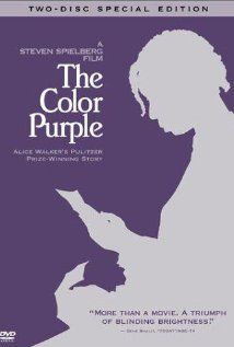 the color purple book cover with a silhouette of a woman reading and holding a bird