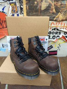 Dr Martens boots used to be Made in England. These are a range from the Golden Era, the 1990d. Boots made then were done so with the best quality leather and stronger rubber for their sole units. This version is a safety rated steel toe boot. It resembles a hiking style boot with d- ring finish.  The sole unit is so strong they are almost indistructable. We have sizes 7-10 available. Hiking Style, Martens Boots, High Top Boots, Dr Martens Boots, Hiking Fashion, Mens Leather Boots, Safety Boots, Brogue Shoes, Leather Lace Up Boots