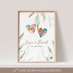 two hearts with leaves are on the wall next to a framed print that says love and dad