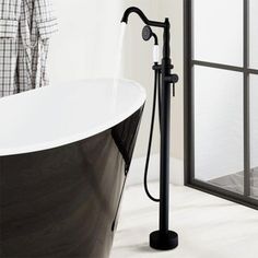 a bathtub and shower head in a bathroom