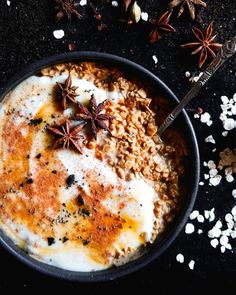 an oatmeal bowl with cinnamon and star anise on top