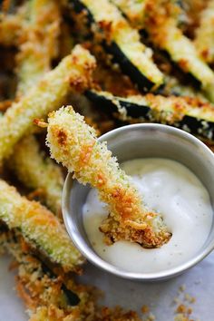 fried zucchini sticks with ranch dressing in a small bowl