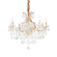 a gold chandelier with crystal drops hanging from it's center and bottom