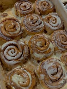 there are many cinnamon rolls in the pan