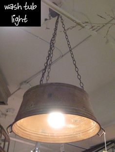 an old fashioned light hanging from the ceiling