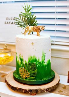 there is a cake with a tiger on top