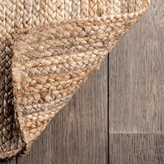 an area rug on top of a wooden floor