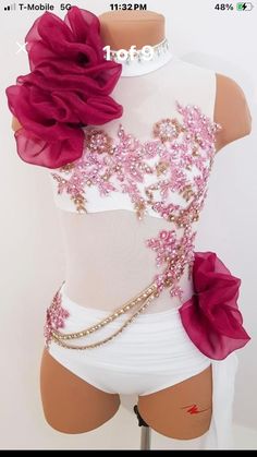 a mannequin with flowers and chains on it