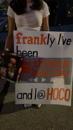 a woman holding up a sign that says frankly i've been drinking booze and ice hoco