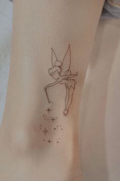 a small fairy tattoo on the ankle