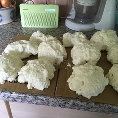 there are several uncooked biscuits on the counter ready to be cut into pieces