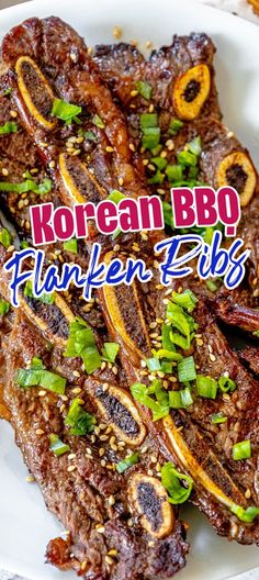 korean bbq flaken ribs on a white plate with green onions and sesame seeds