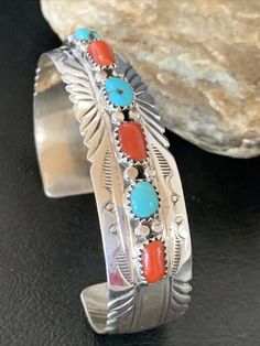 Masha Indian Native American Jewelry   -On Route 66 -         Albuquerque, New Mexico U.S.A   Item Specifics Regional Style: Native American Stone: Kingman Turquoise & Coral Size: 6.25" Gap: 1.10" Top Measurement: 0.5" Color: Blue & Red Tribal Affiliation: Navajo Artisan: S Metal: Sterling Silver Purity: 925 Made in USA SKU: 12315 Genuine Sterling Silver Jewelry  This beautiful Bracelet is made from all 925 Sterling Silver. These pieces are painstakingly handmade by the artist creating the perfe Navajo Silver Jewelry, Jewlery Rings, Nashville Outfit, Turquoise Jewelry Native American, American Indian Jewelry, Southwest Jewelry, Women's Outfits, Navajo Jewelry, Native American Turquoise