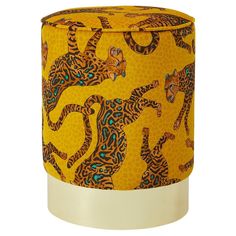 a yellow and black animal print stool with white legs