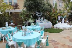 an outdoor party with blue and white decorations