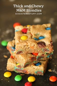 three pieces of cookie bars with m & m candy on top