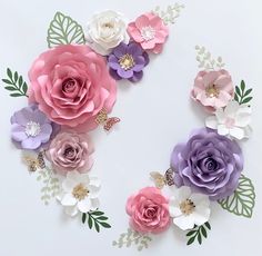 paper flowers arranged in the shape of an o