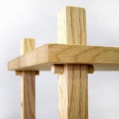 a wooden cross is shown against a white background