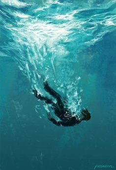 a man swimming under water in the ocean