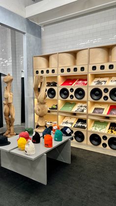 there are many hats on display in the store