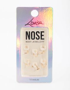 a package of nose and ear piercings on a white background