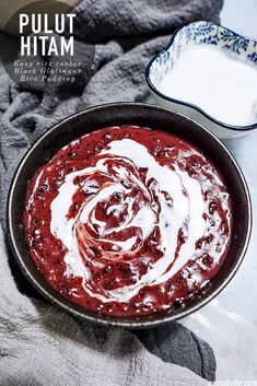 a bowl filled with red sauce and cream