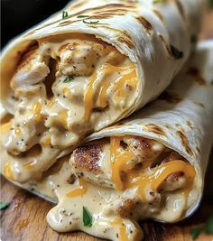 chicken enchilada wrapped in tortilla wrap on a wooden cutting board