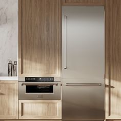 a stainless steel refrigerator and oven in a kitchen