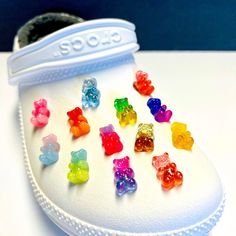 a pair of white shoes with gummy bears on them