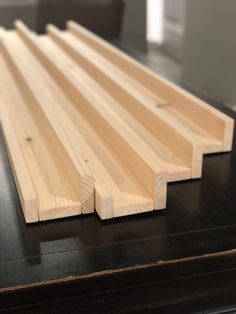 some wood planks laying on top of a table