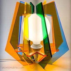 a colorful lamp is sitting on the floor