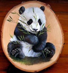 a painting of a panda bear sitting on top of a piece of wood eating bamboo