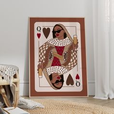 an ace playing card on the floor next to a wicker chair and white curtains