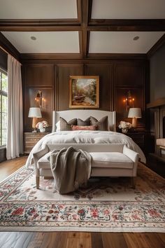 a large bed sitting in the middle of a bedroom