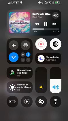 an iphone screen with various buttons and icons on the phone's display, including music player