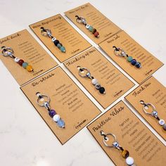 six pairs of earrings are displayed on the table